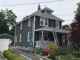 In progress job of new siding installation