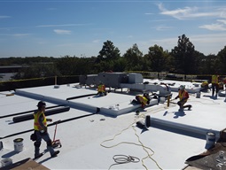 Contractors working on roof in Hauppauge
